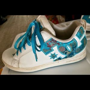 Women’s size 8.5 DC shoes. Blue embroidered designs.